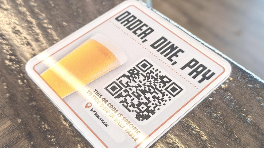 QR code sticker on a restaurant table for ordering, menu and paying bill